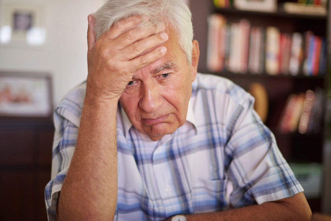 thoughtful-senior-man-living-room_329181-14662